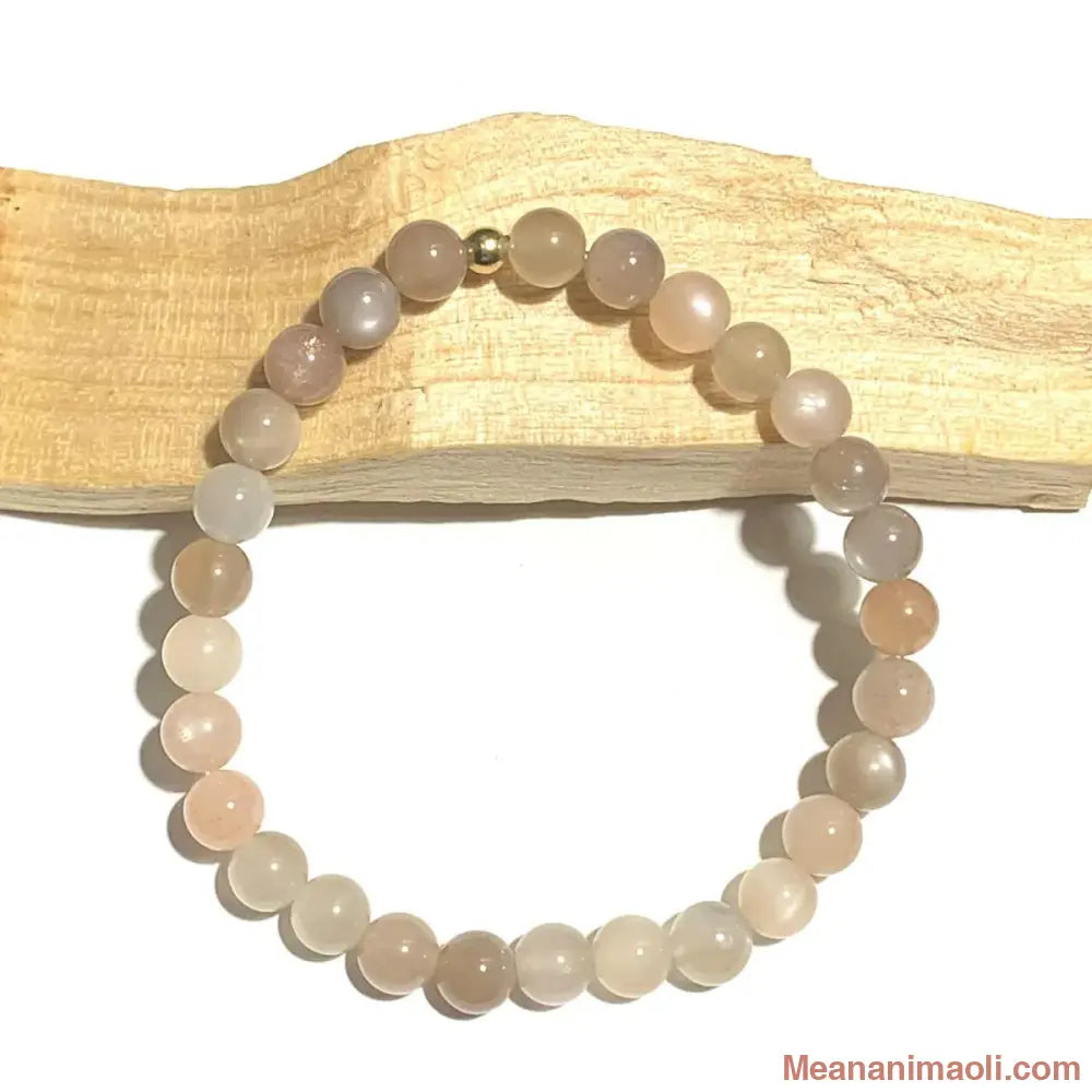 Bracelet Pierre de Lune Multicolore 6 mm et perle de jonction en acier inoxydable doré.