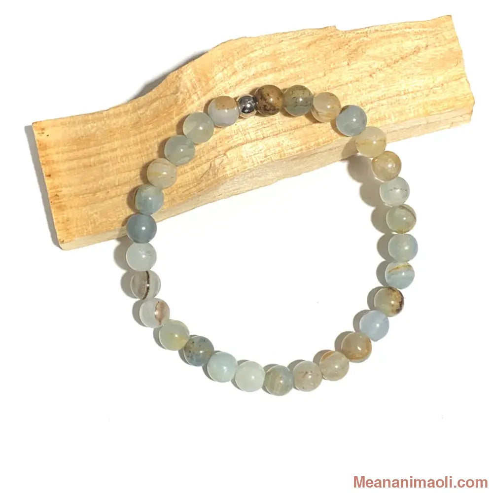 Bracelet Calcite Bleue 6mm, avec une seule perle acier inoxydable argenté.