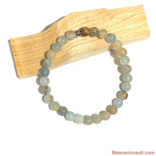 Bracelet Calcite Bleue 6mm, avec une seule perle acier inoxydable argenté.