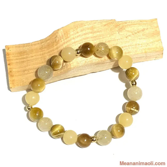Bracelet quartz rutile jade jaune œil de tigre 8 mm en pierres naturelles pour lithothérapie avec pelres acier inox doré.