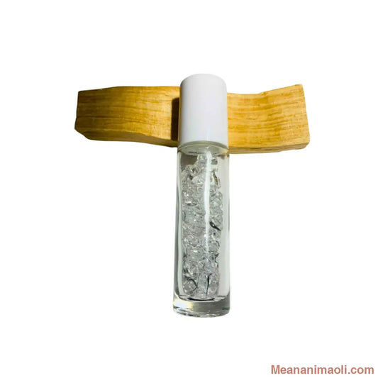 Flacon Roll-On rechargeable en verre transparent avec bille diffuseur en Cristal de Roche naturel. Utilisé pour l'application d'huiles essentielles. Produit MEANANIMAOLI.